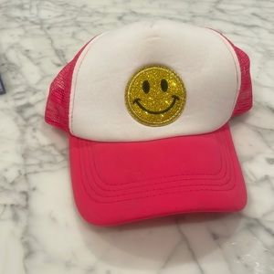 Smily face, trucker hat, pink.